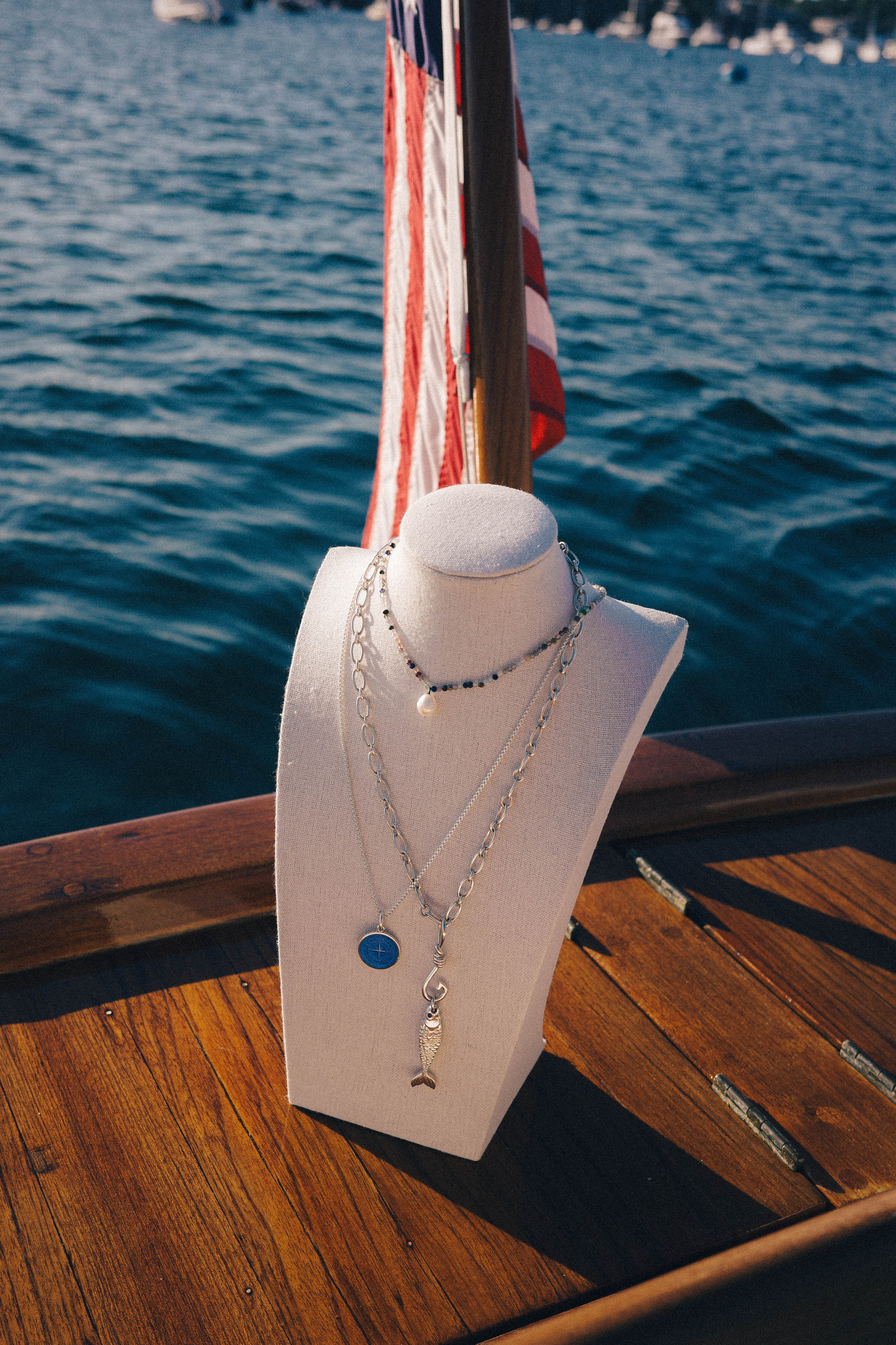 Colby Davis of Boston jewelry displayed on a boat